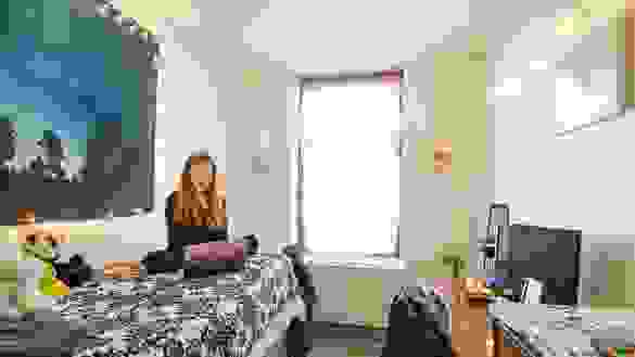 Student in a single room in the Ludlow Residence Hall.
