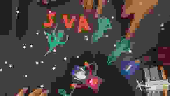 Still from stop-motion animation featuring paper cutouts of aliens and a cat-stronaut