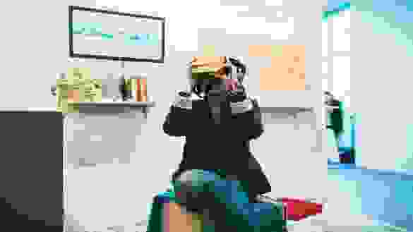 person looking through a vr box