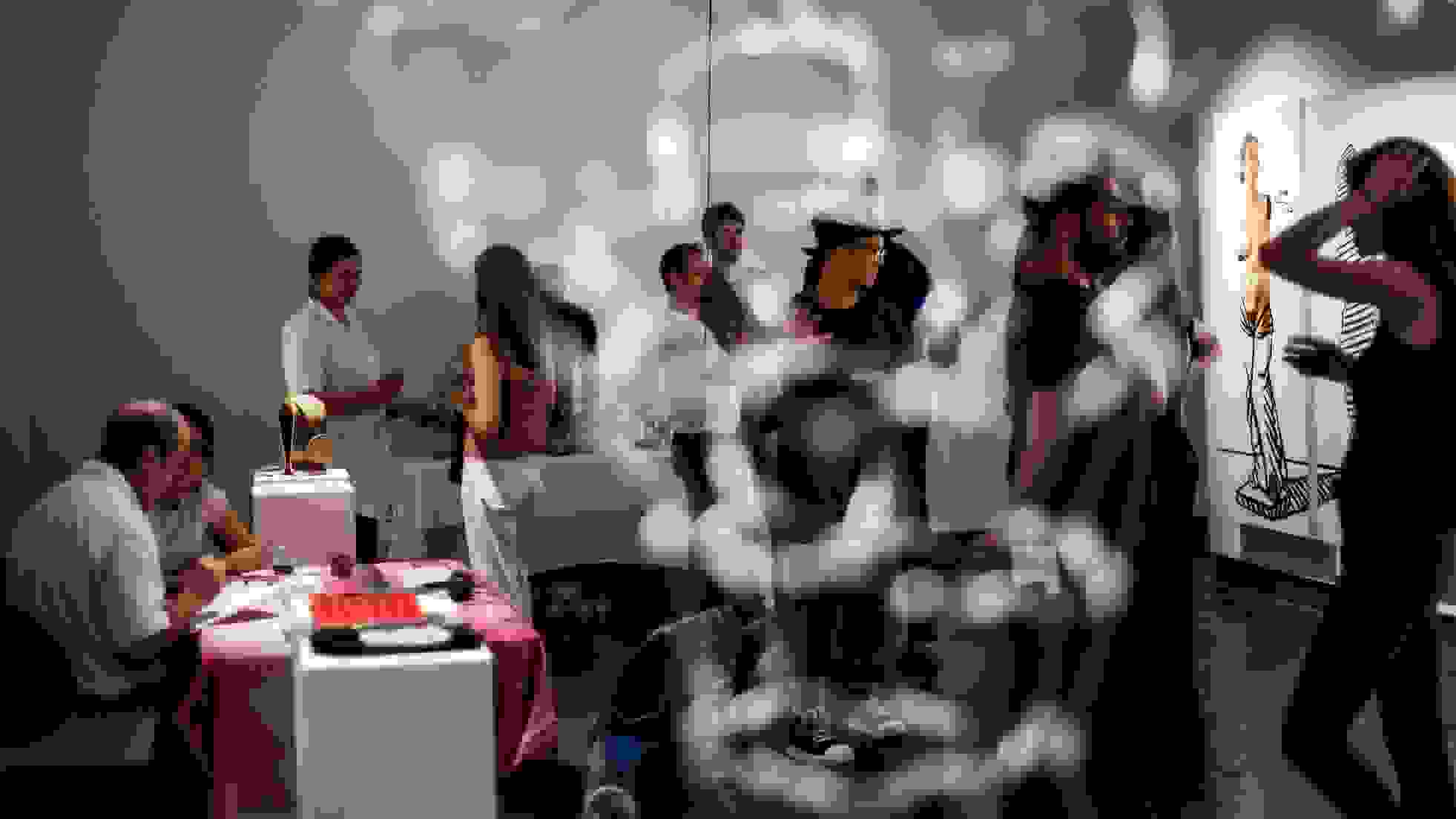 Students and professor in studio with art installation