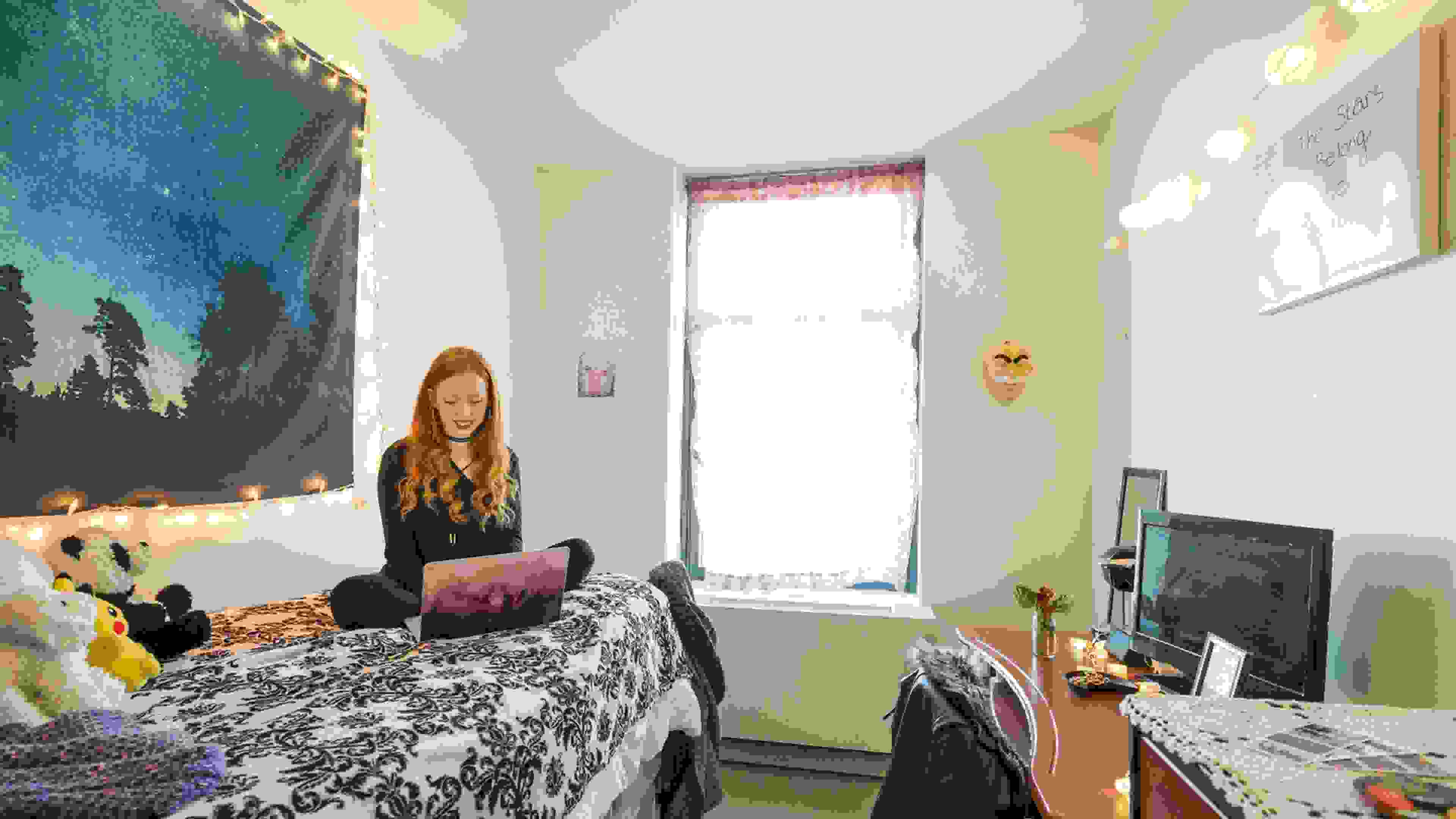 Student in a dorm room.