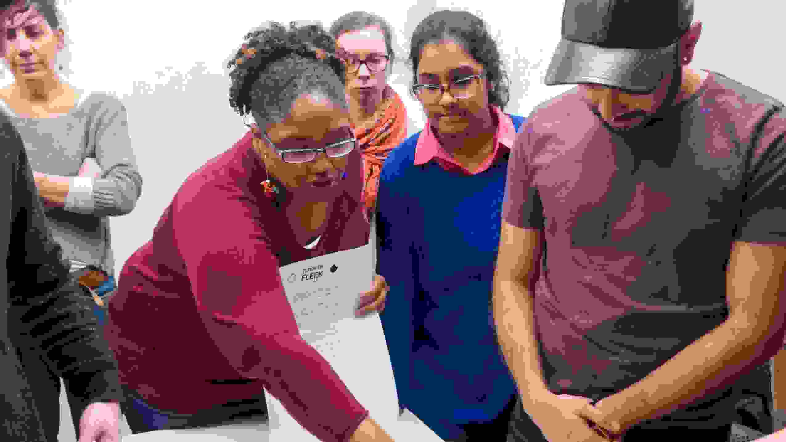 Students gathered around table.