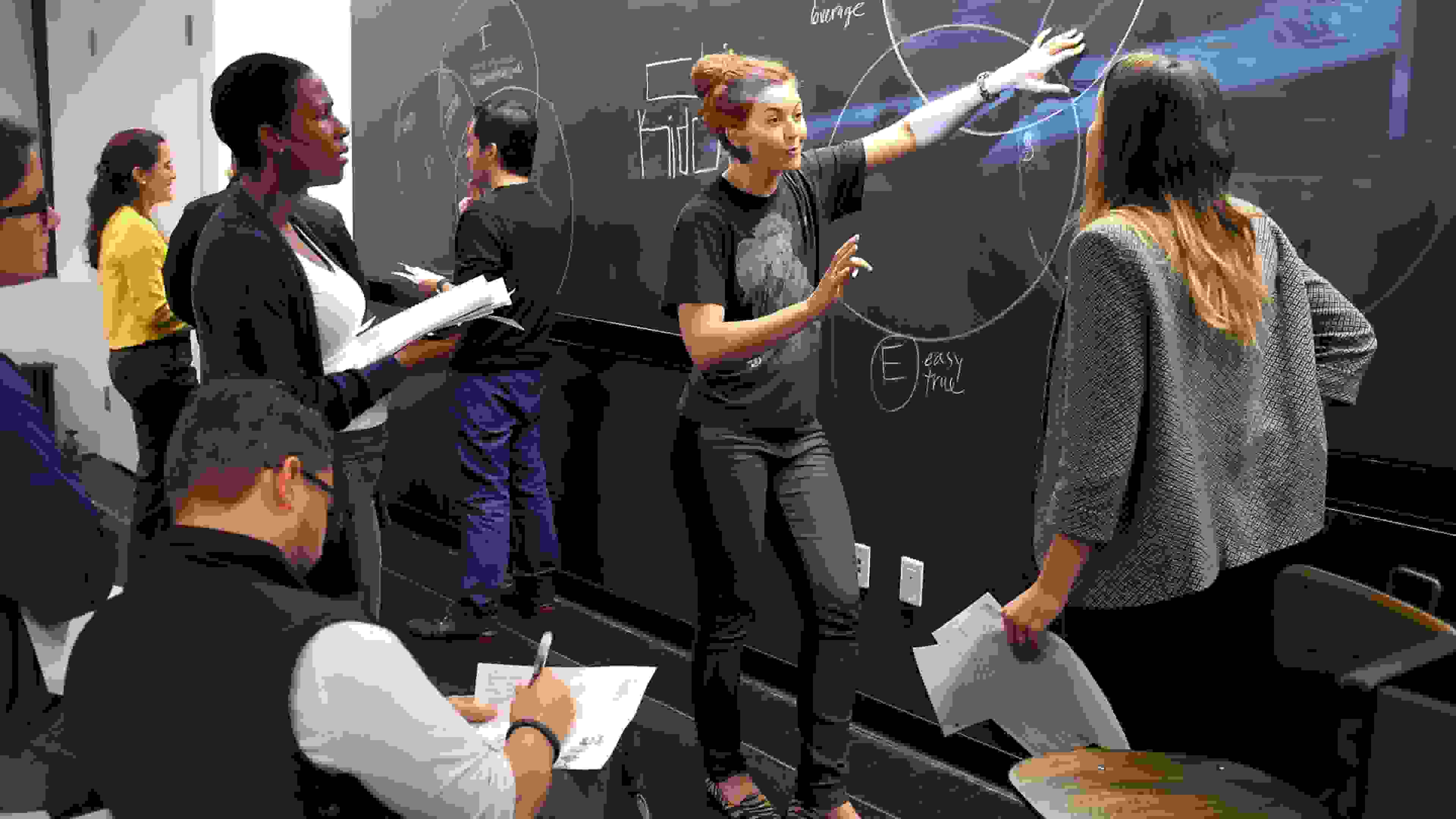 Professor presenting diagram to students