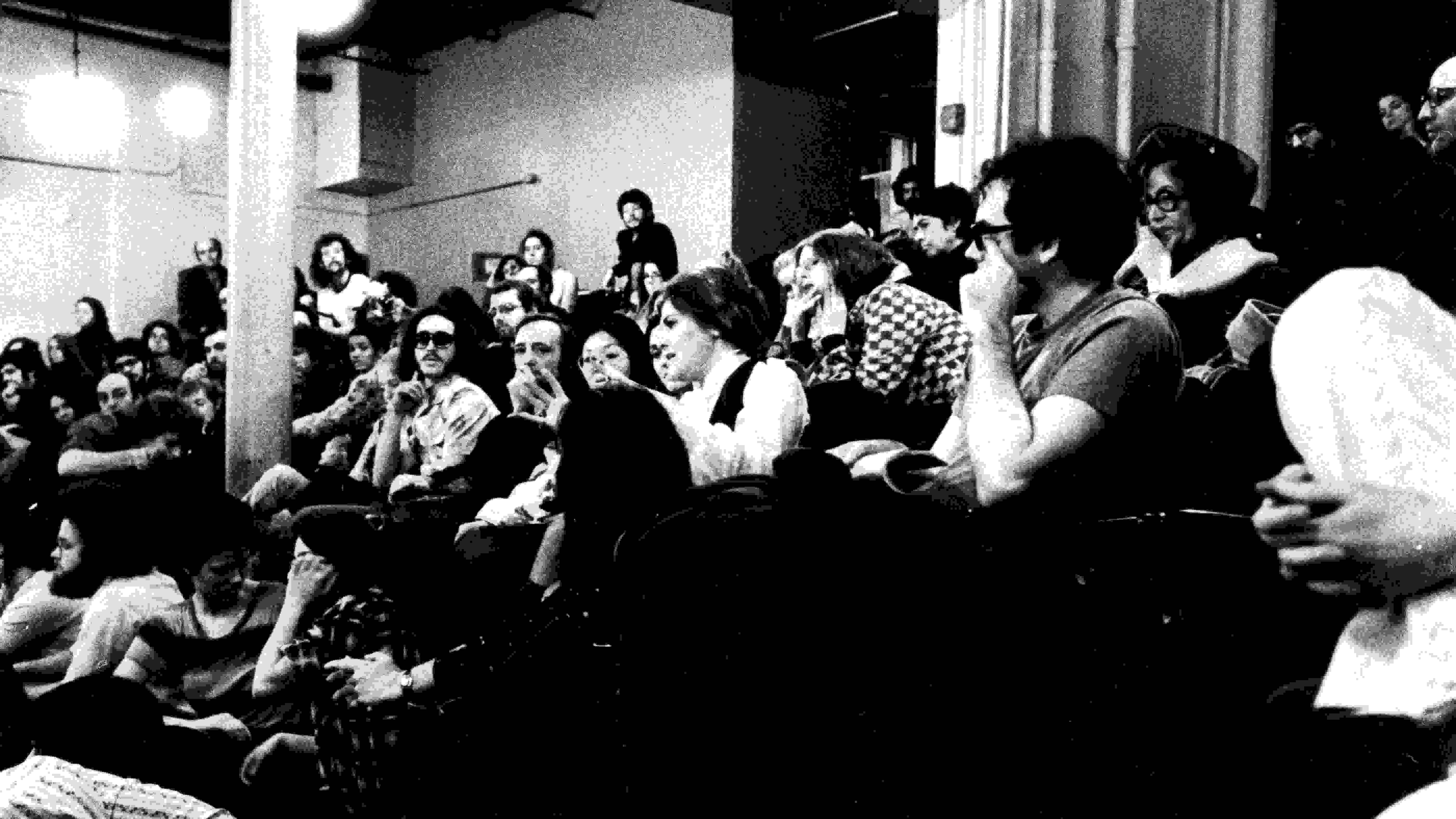 black and white photo of students in auditorium