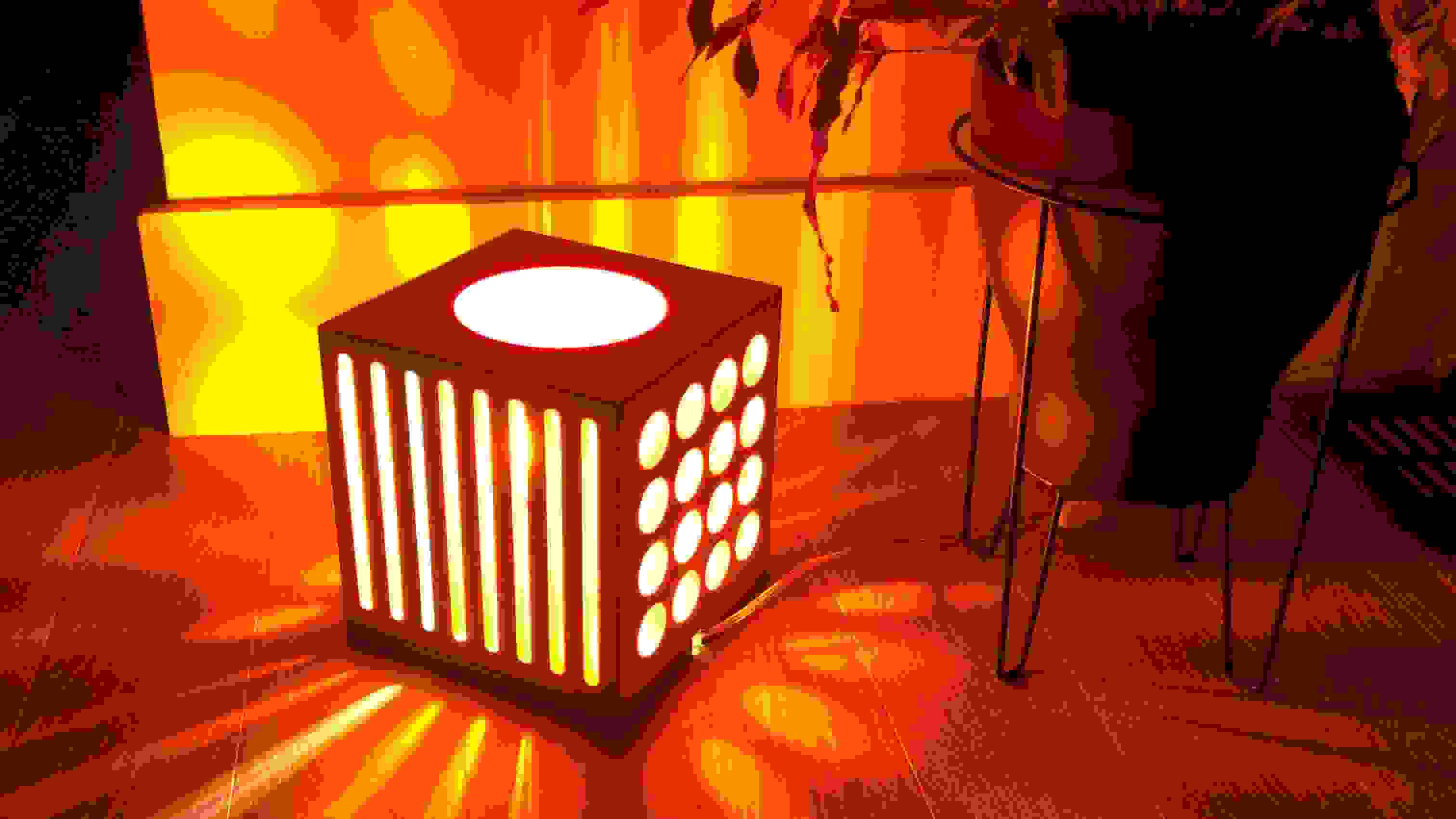 An illuminated light box on the floor of a residential space.