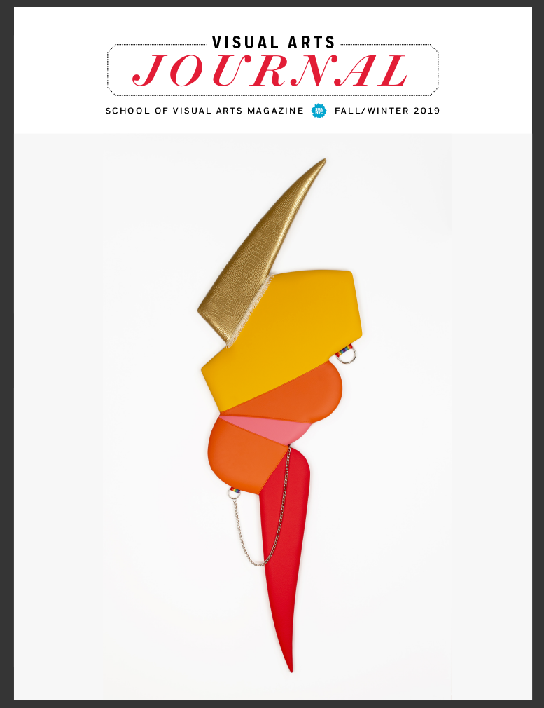 A magazine cover featuring a color photograph of a lightning-bolt shaped sculpture against a blank background. The sculpture incorporates a variety of fabrics and a chain.
