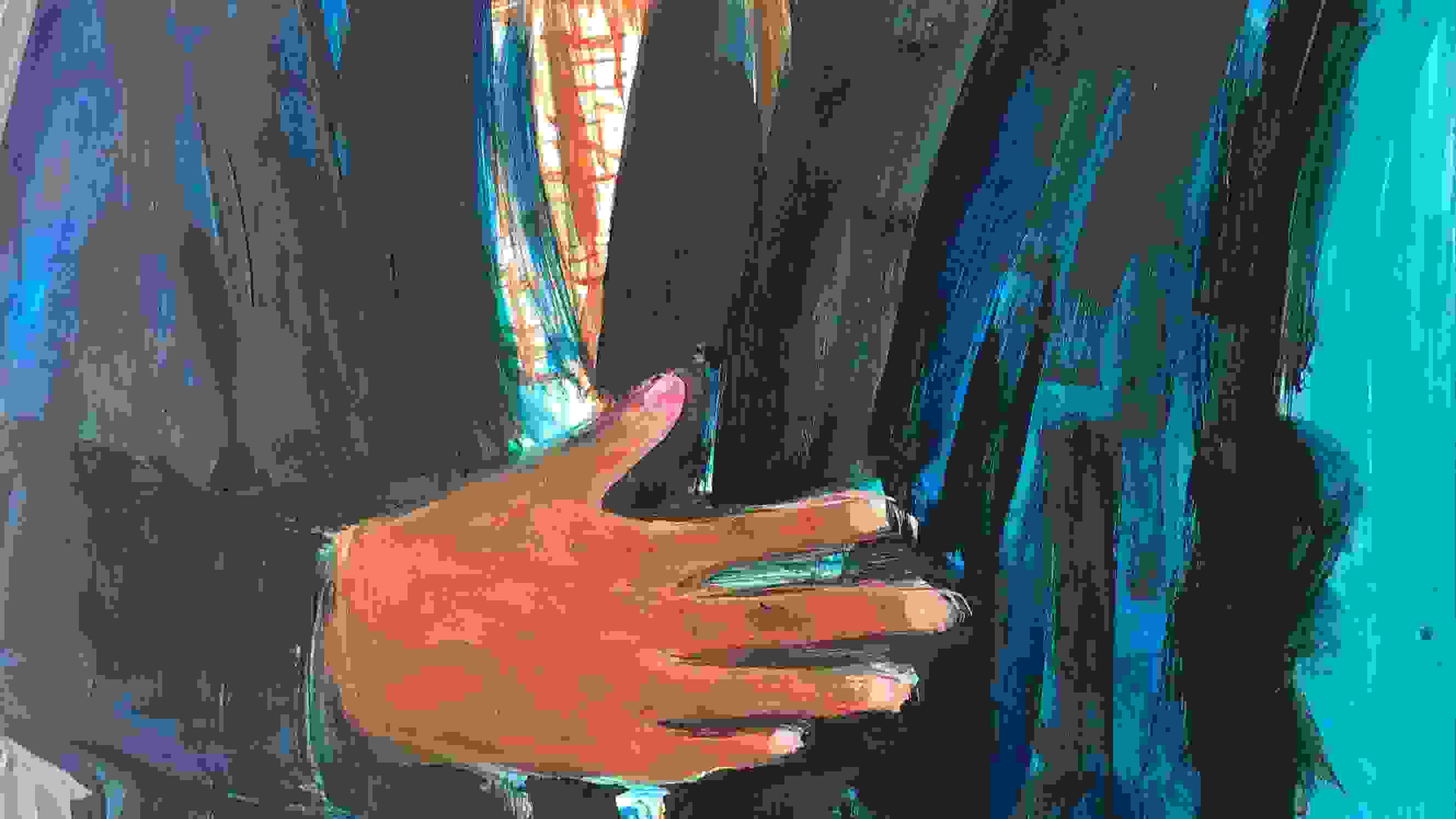 Painting of a man's torso.  The man is wearing a blue suit jacket and his hand is resting on his stomach.
