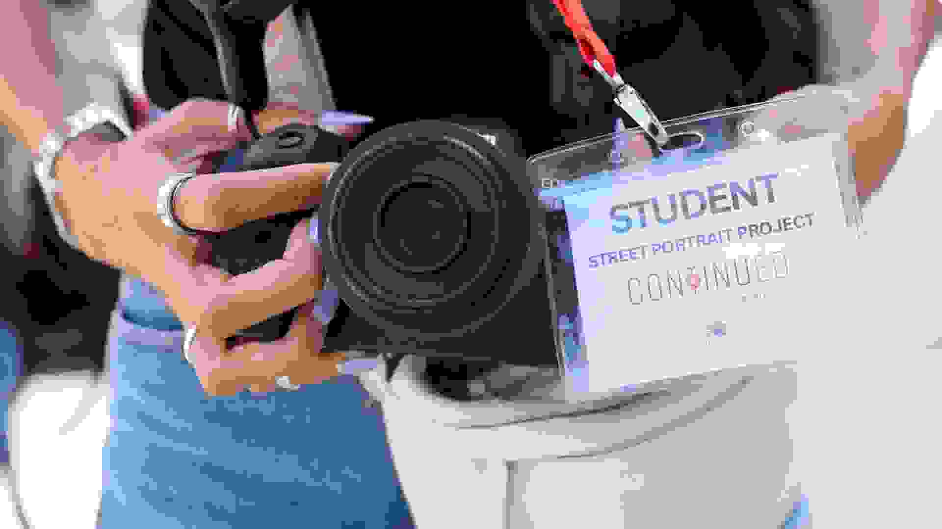 Hands holding a digital camera