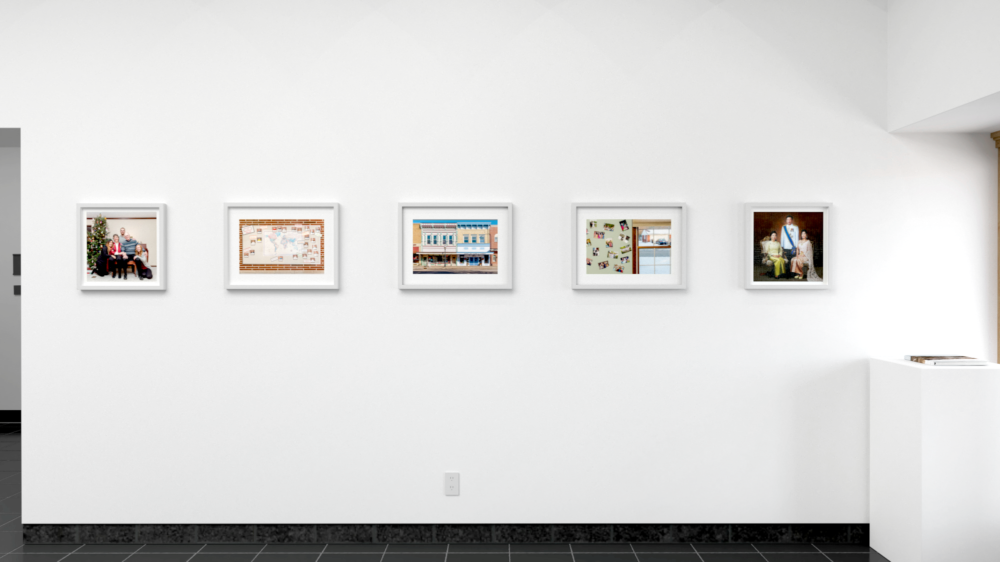 Five color photographs in horizontal row, each in a white frame, with a small book on pedestal to their far right.