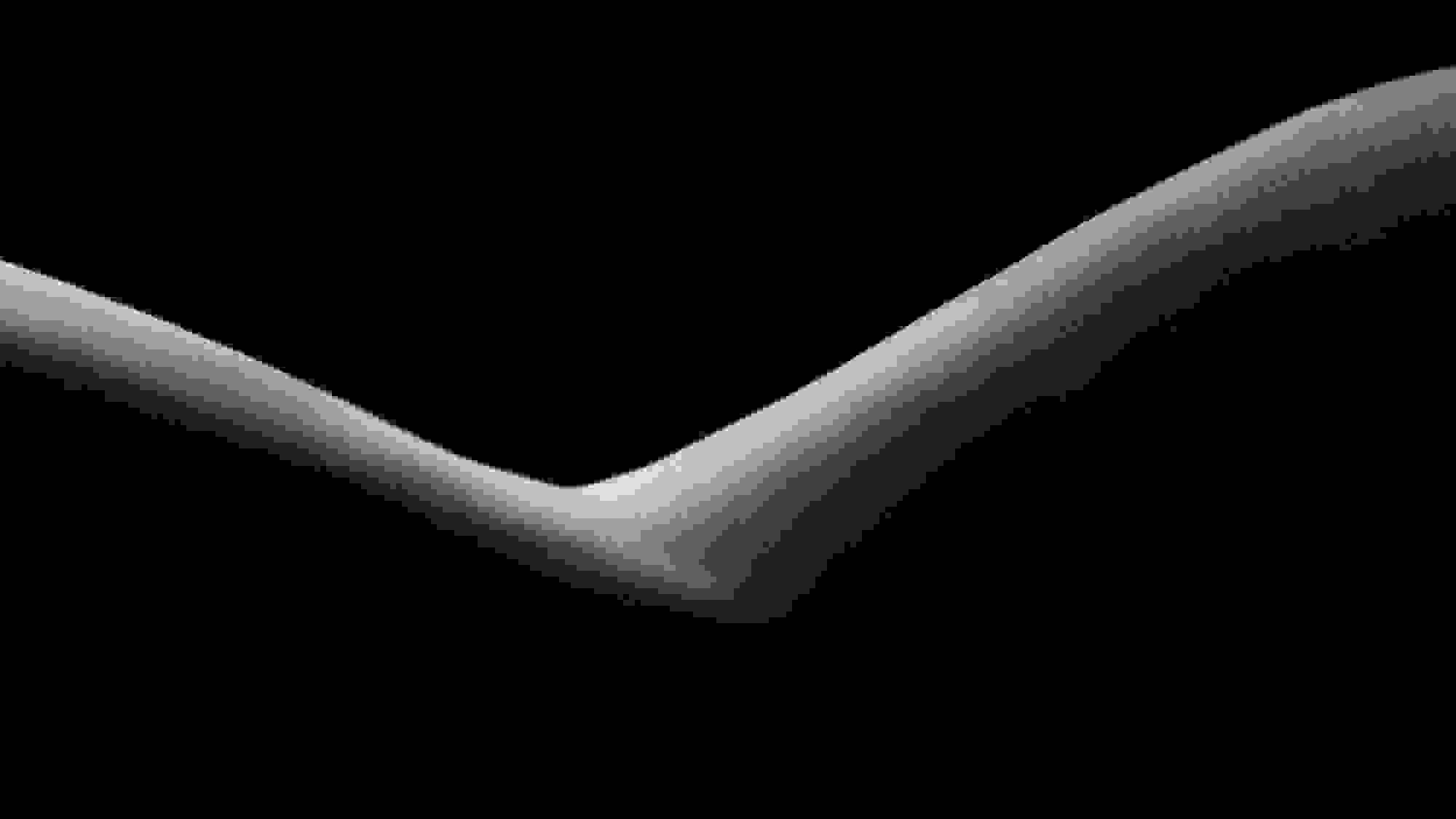 A black-and-white abstract photograph of the edge of a person’s side, lit from the top down so only the edge of their shape is in the light.