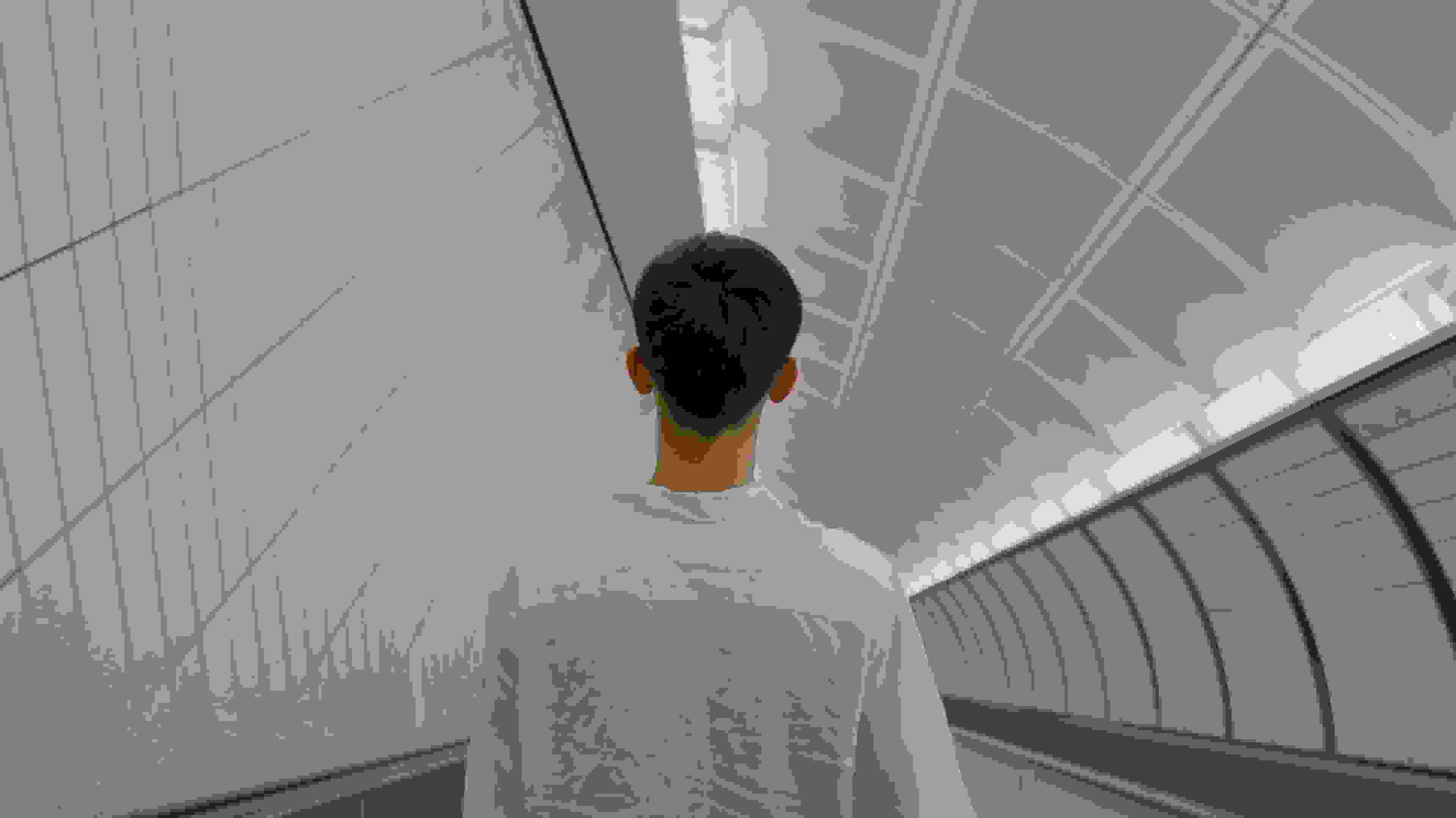 A boy wandering in the subway station.