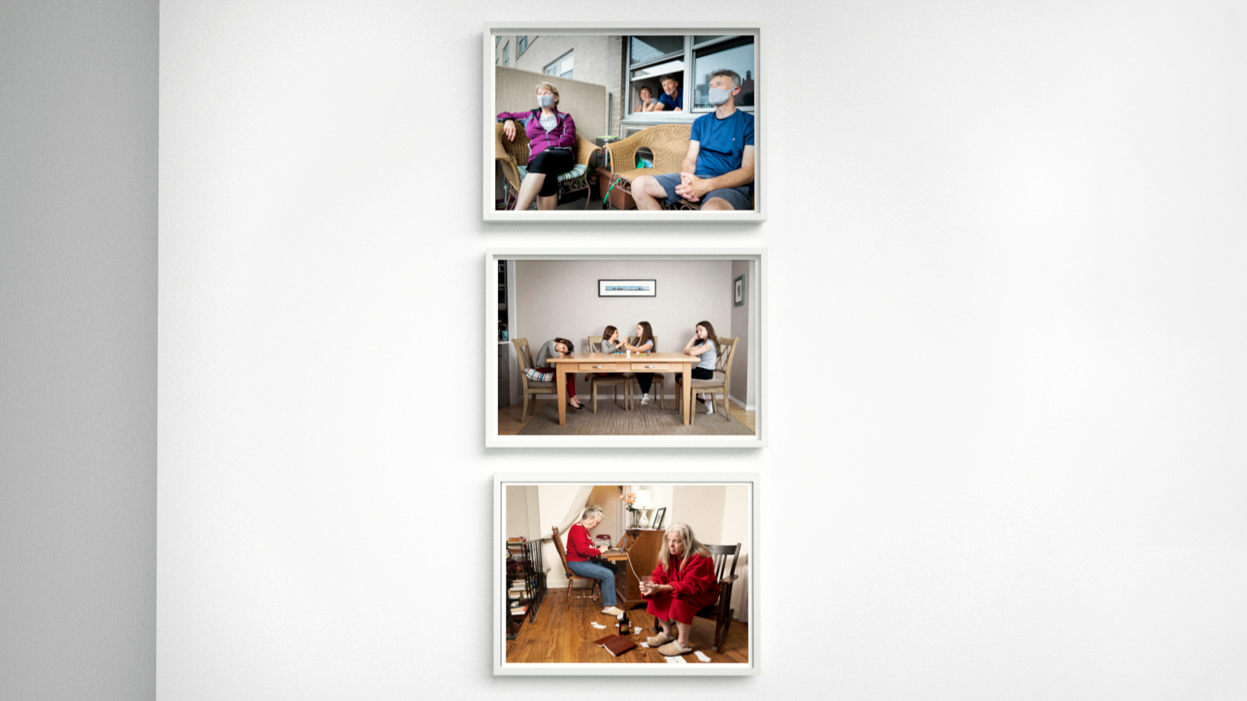 Three color photographs in vertical line in white frames.