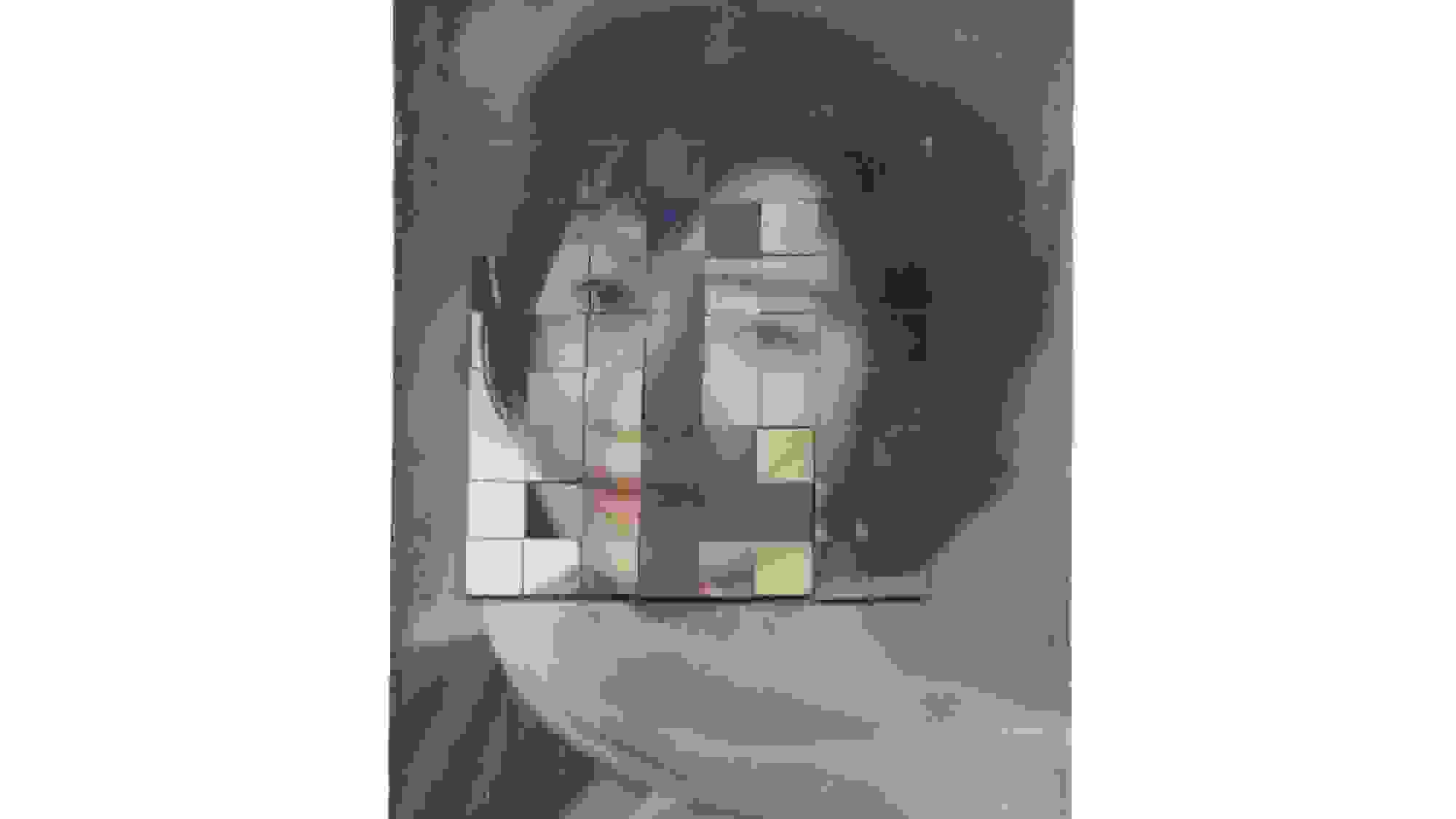 A photograph taken of a scanned old photograph of the portrait of a woman. Physically interwoven over her face have been two strips of photographs of other women’s faces.