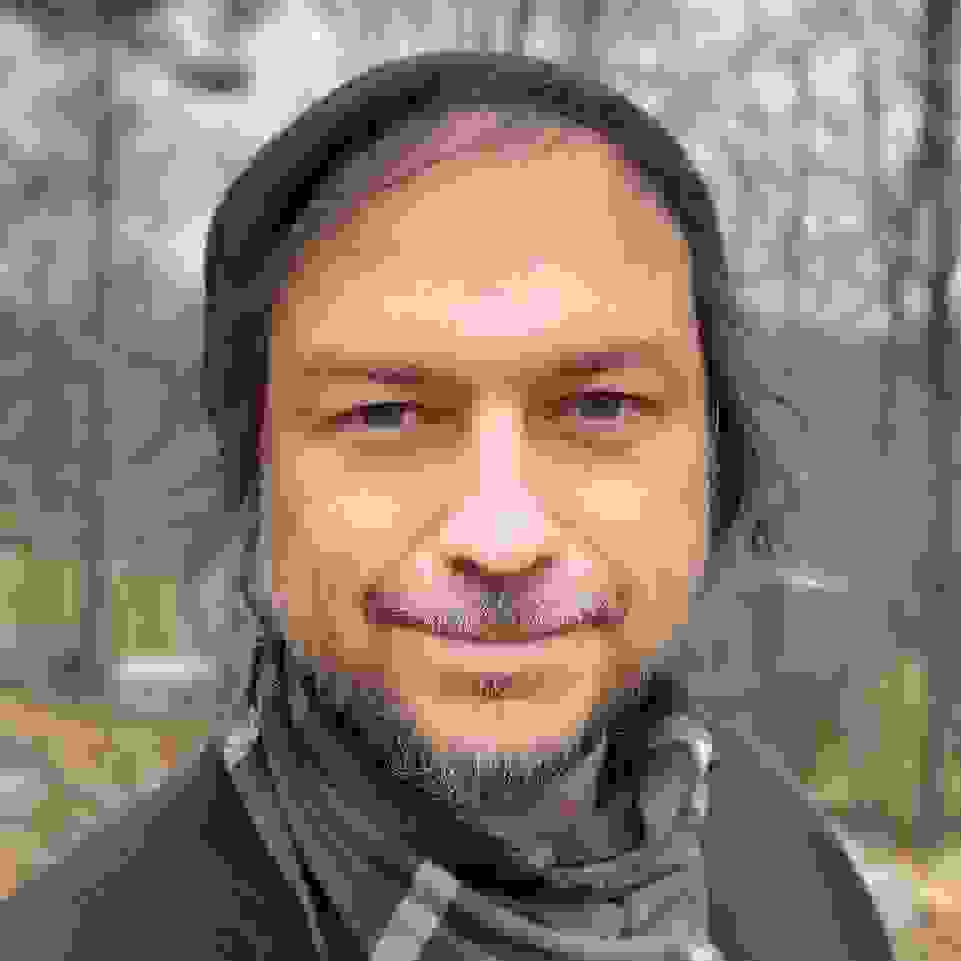 man in forest clearing