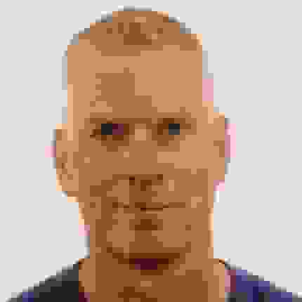 smiling man in t shirt