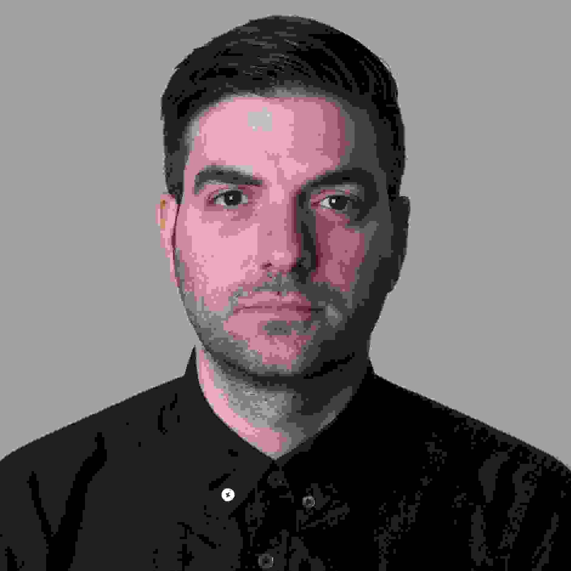 Portrait, male, grey background, black shirt