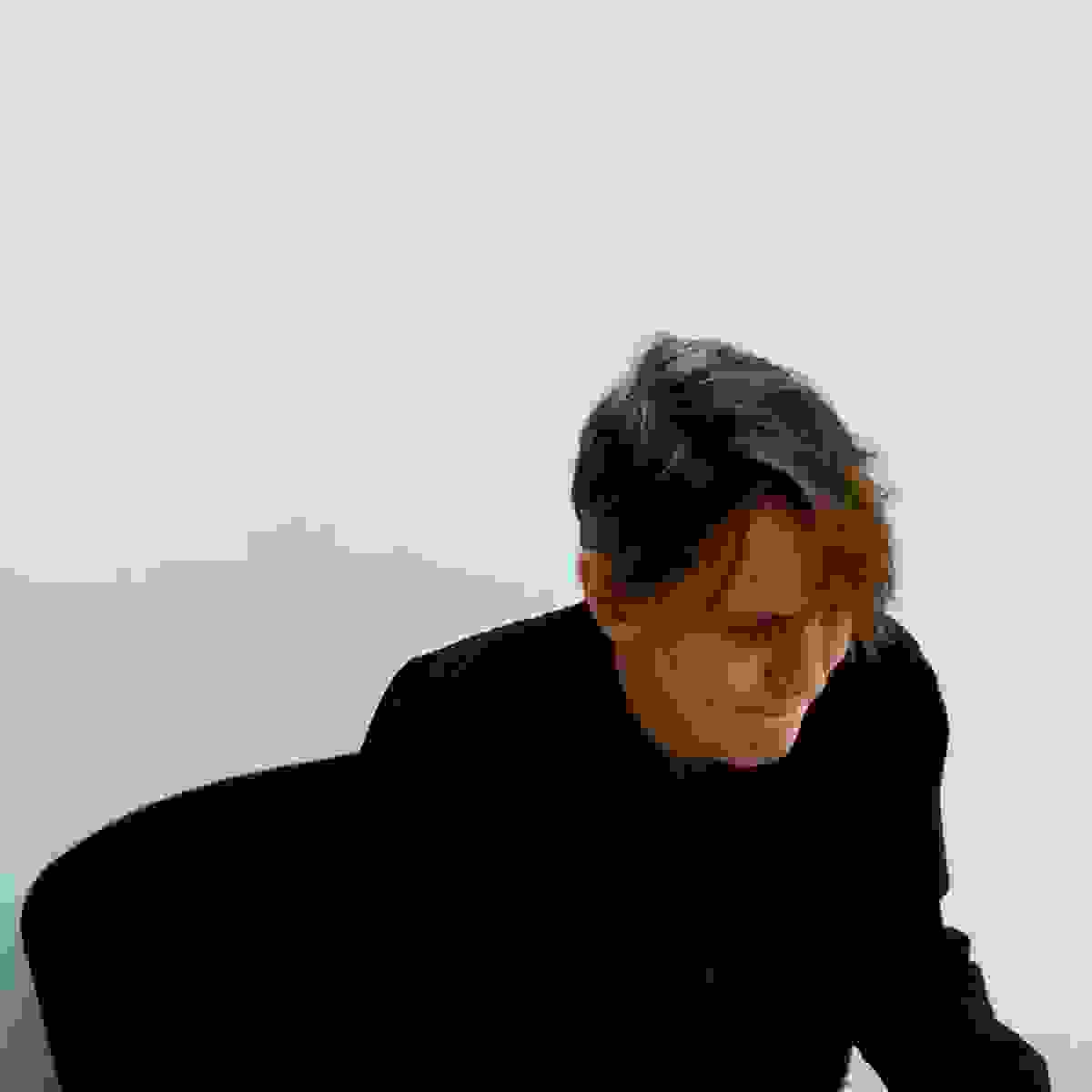 Image of a person looking downward.