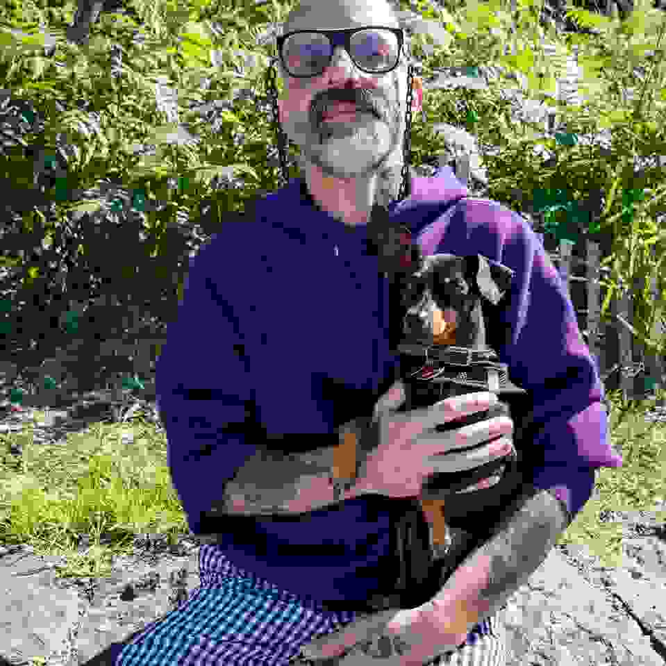 man in glasses with dog