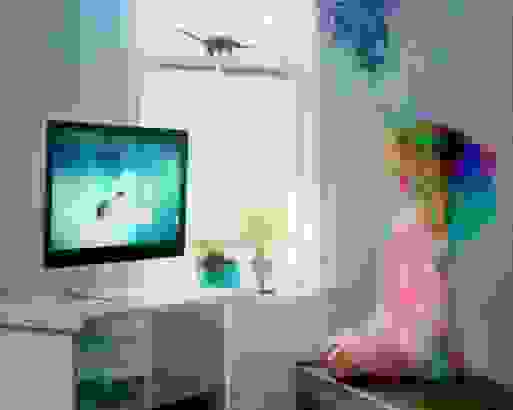 Girl watching a unicorn on her t.v. The girl on the right is moving and smiling.