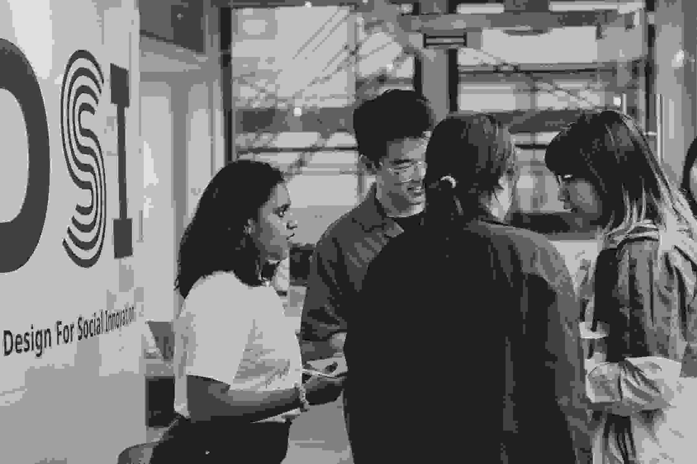 Black and white photo of students collaborating