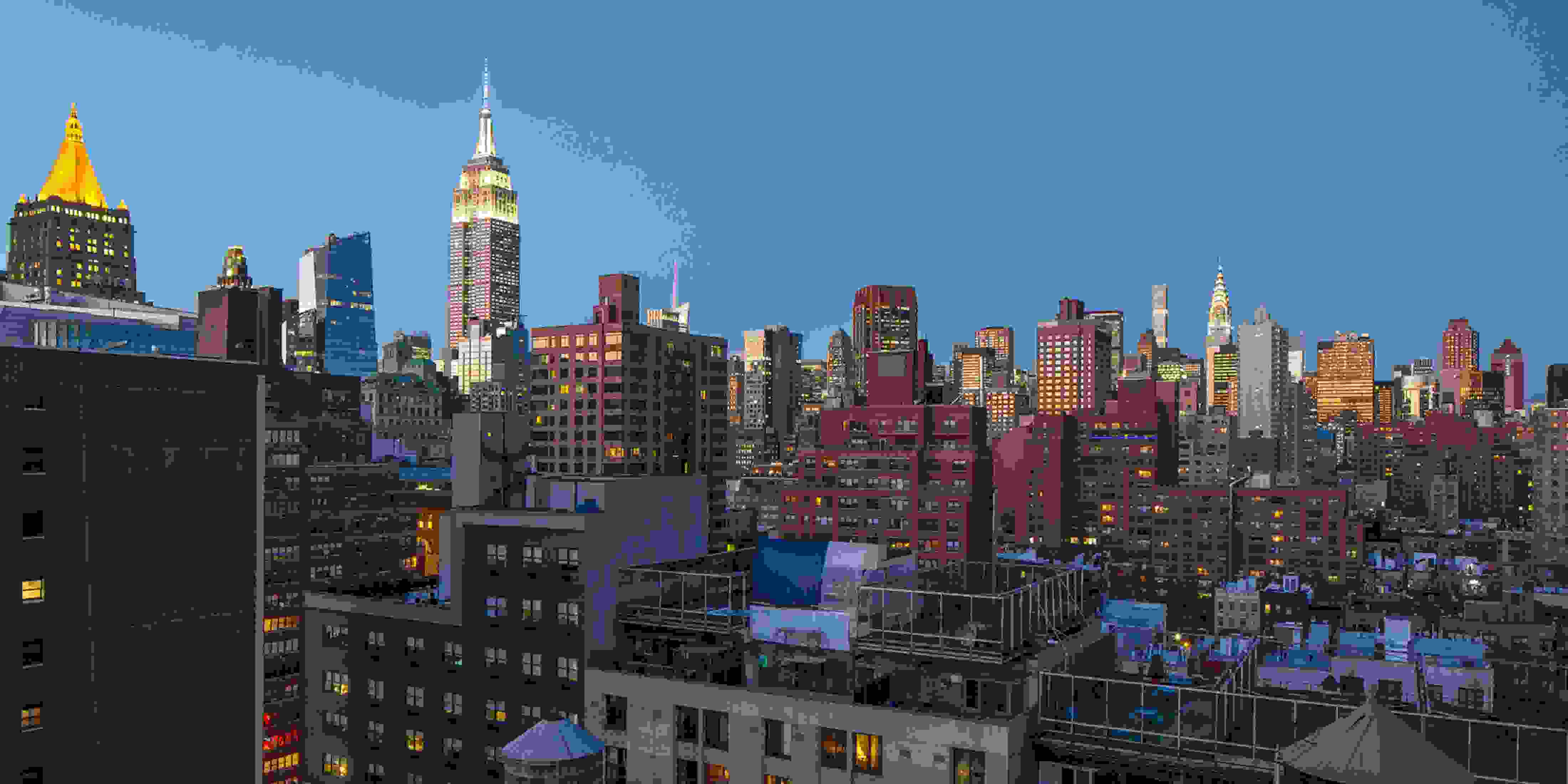A skyline showcasing differently sized buildings, some made of brick, others made of concrete.
