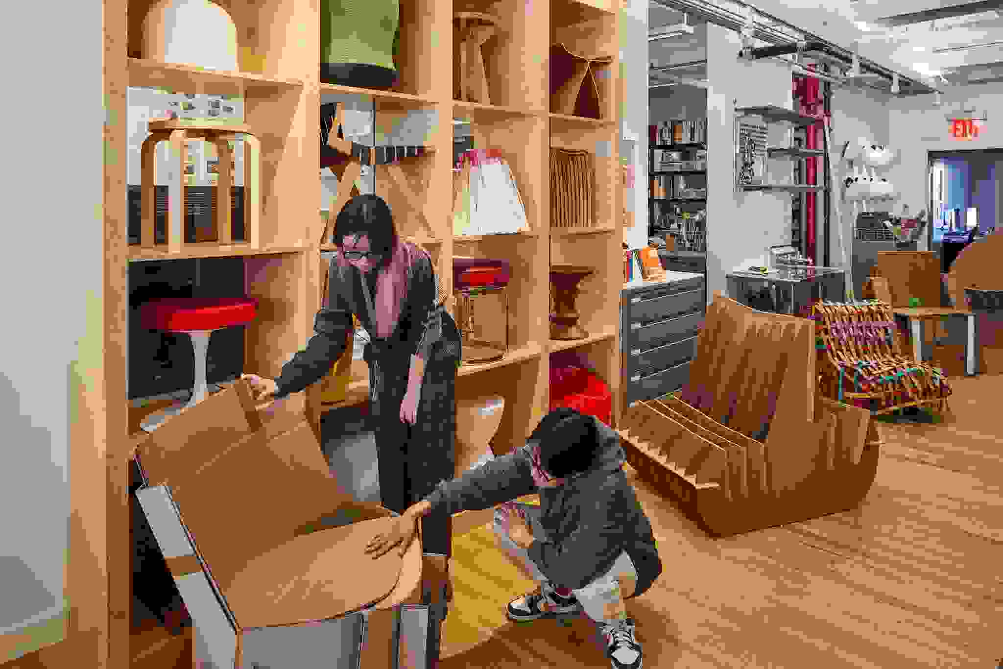 Students examine an item from the chair lab.
