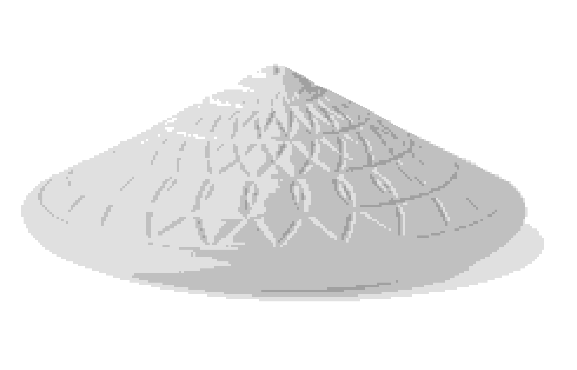 A white object pyramidal in shape. It has patterned engraving on the surface.