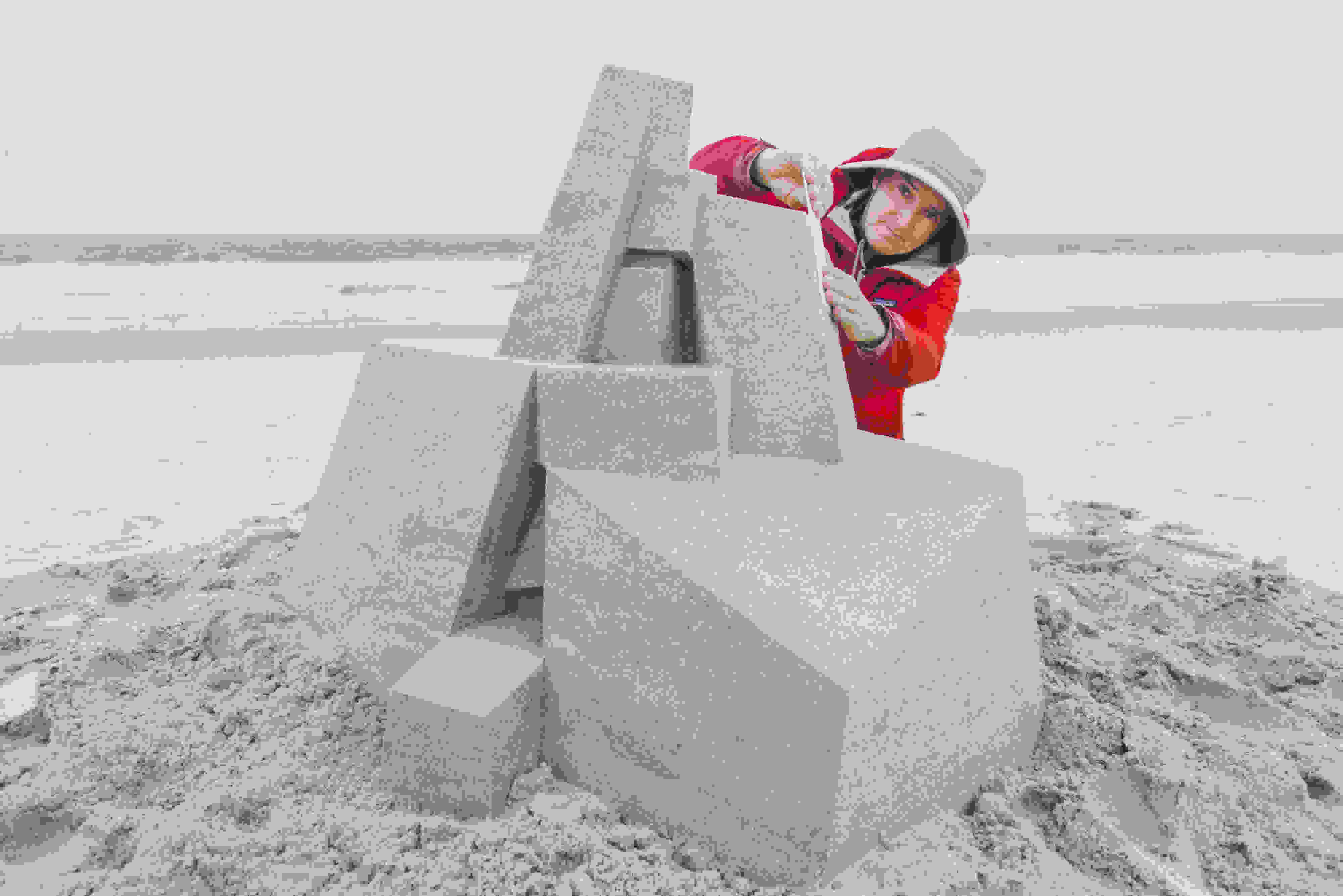<p "="">SVA alumnus Calvin Seibert puts the finishing touches on a sandcastle sculpture at Rockaway Beach, Queens.