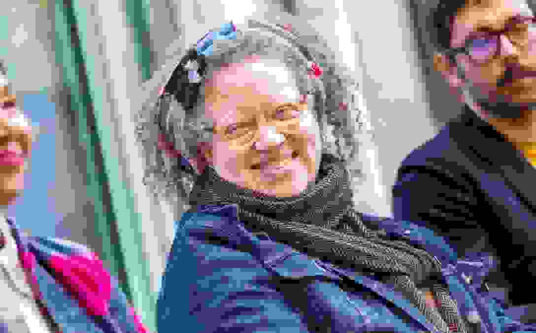 Gail Anderson smiles and looks to her right during a panel discussion.