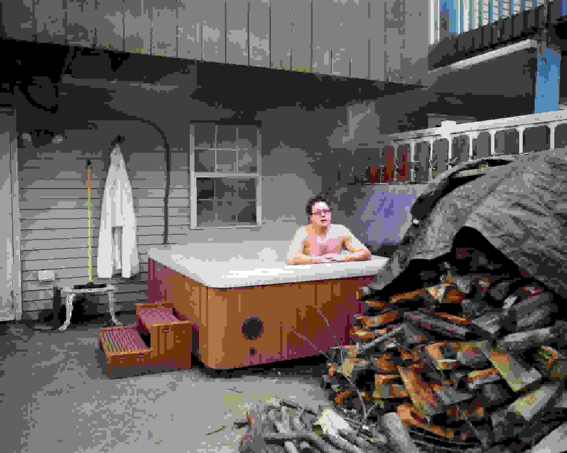 A picture of a guy inside a jacuzzi