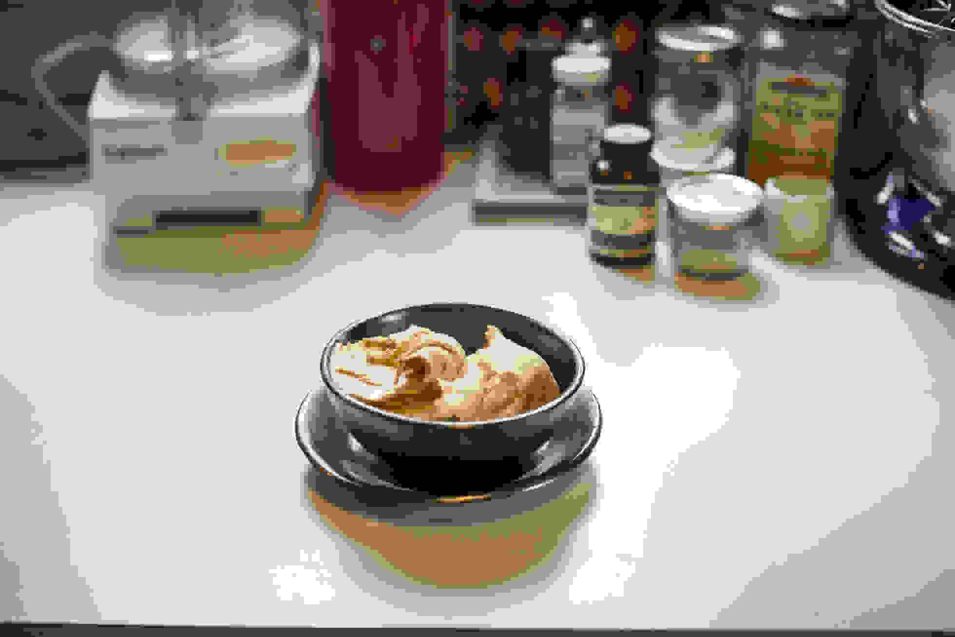 A bowl of gelato on a kitchen countertop.