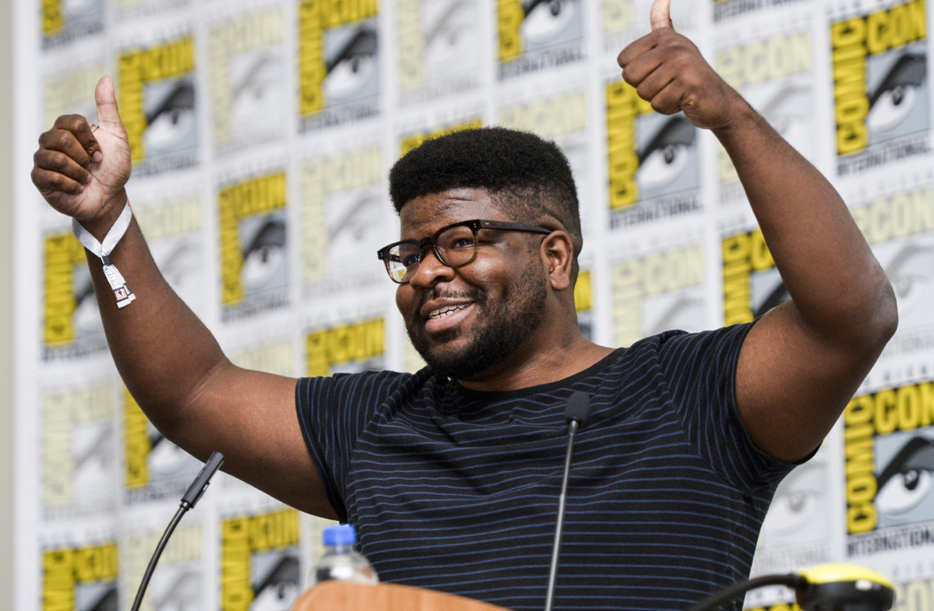 Ian Jones-Quartey gives two thumbs up from his place on the stage at the San Diego Comic Con.
<br>