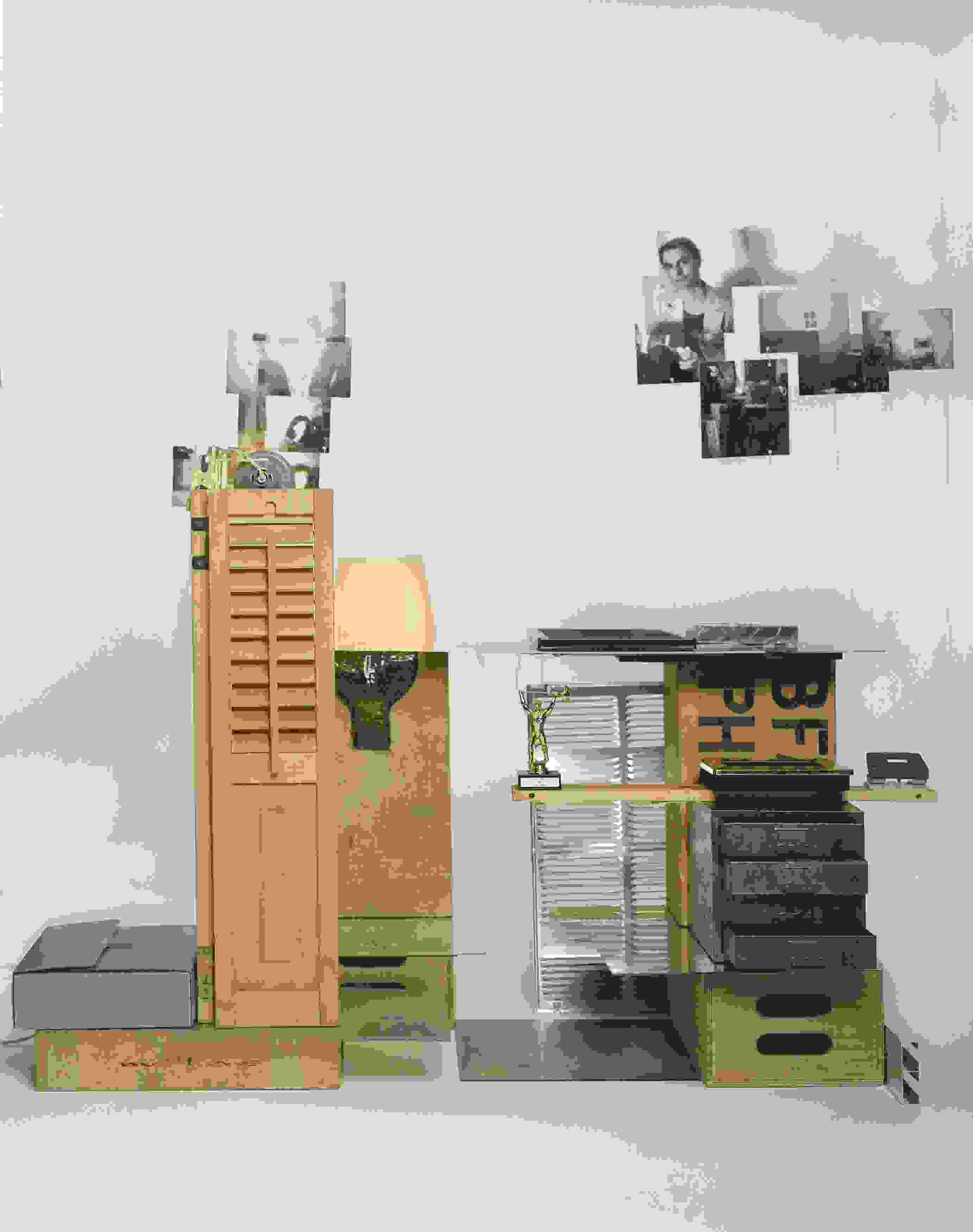 art installation including photos, drawers, wooden apple boxes