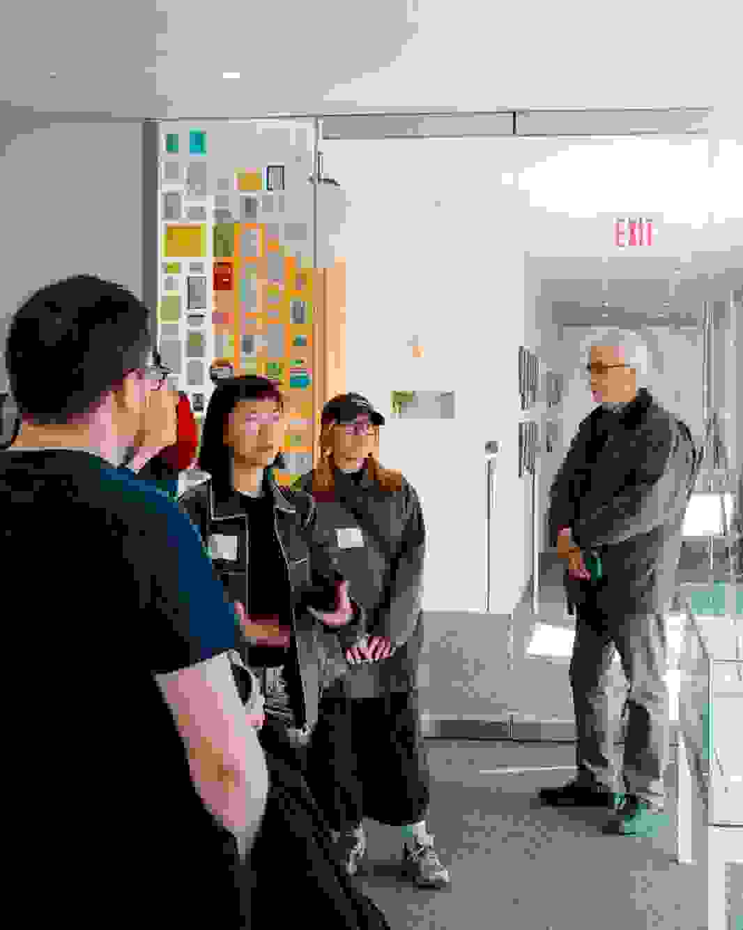 A photo from a class visit to the New York Times headquarter in New York City, where the Masters in Digital Photography students are inquiring about the history of the famed newsroom.