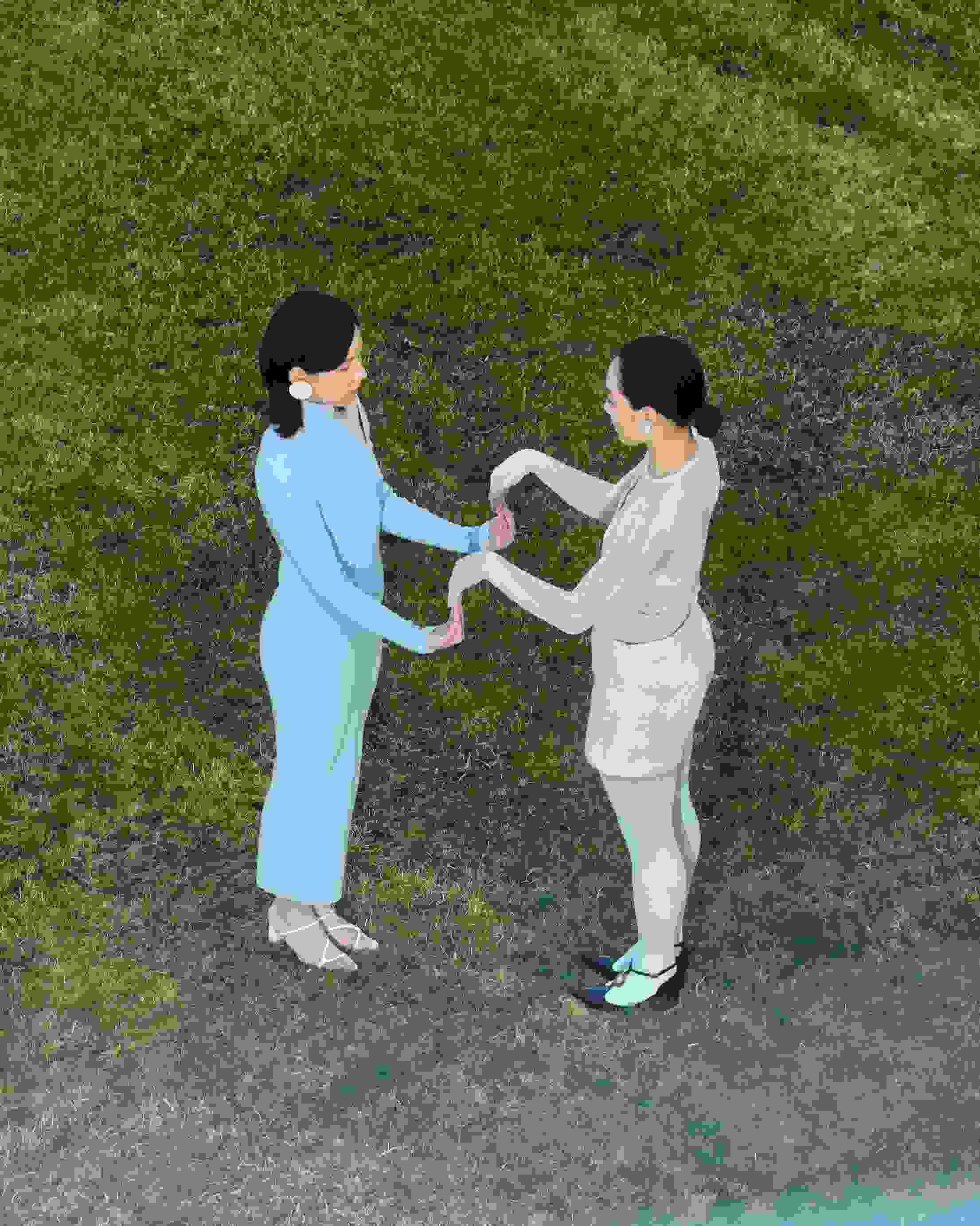 Two people play a hand clap game.