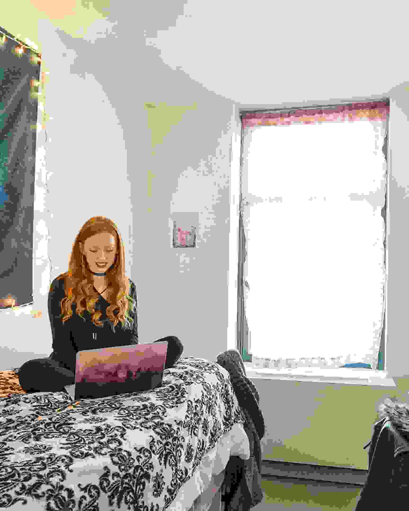 Student in a dorm room.