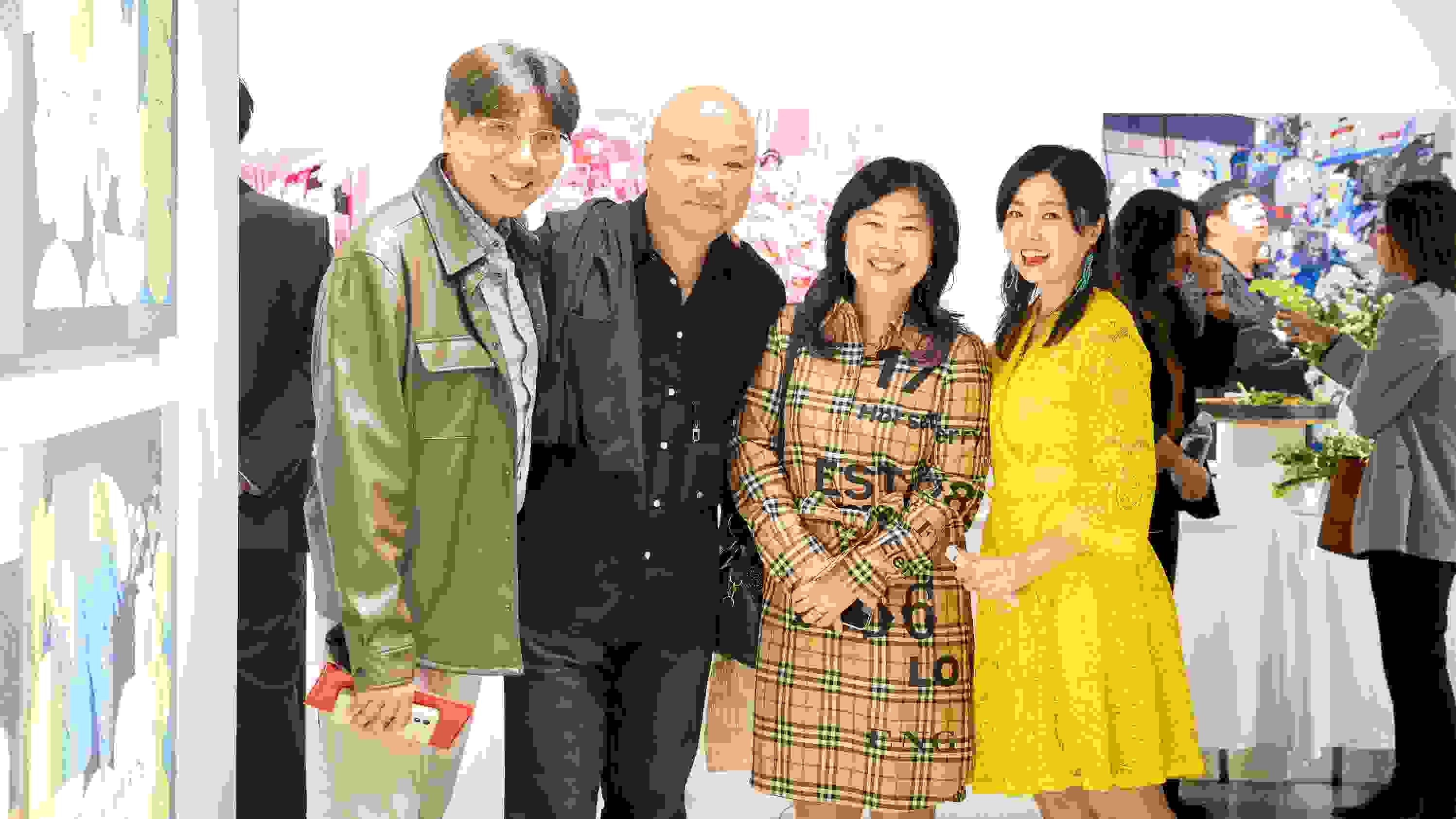 A group of people pose for a photo in SVA's Andrew Chang Gallery in Seoul.