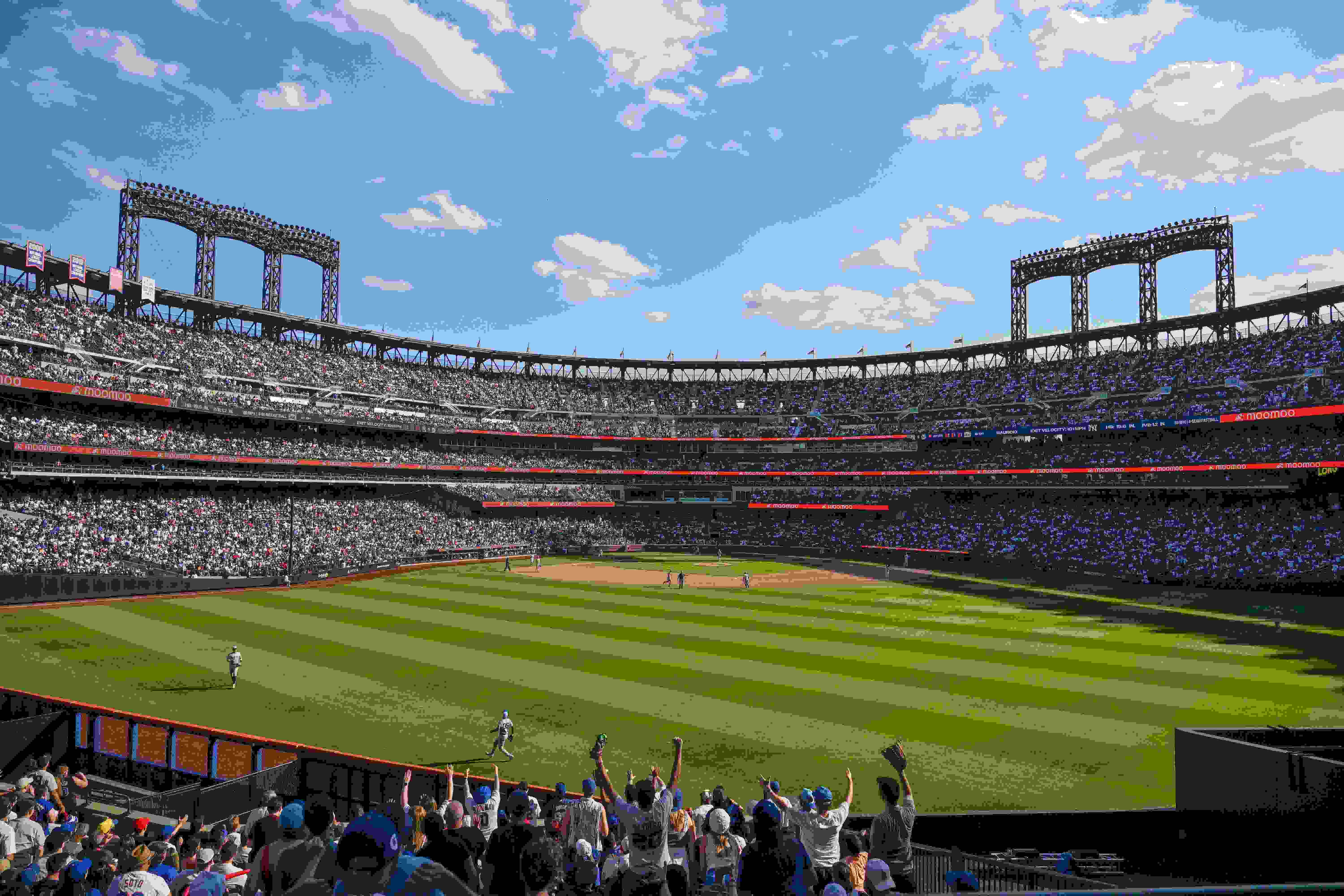A photograph of the crowd at a sold-out day game at Citi Field, the home stadium of the New York Mets.