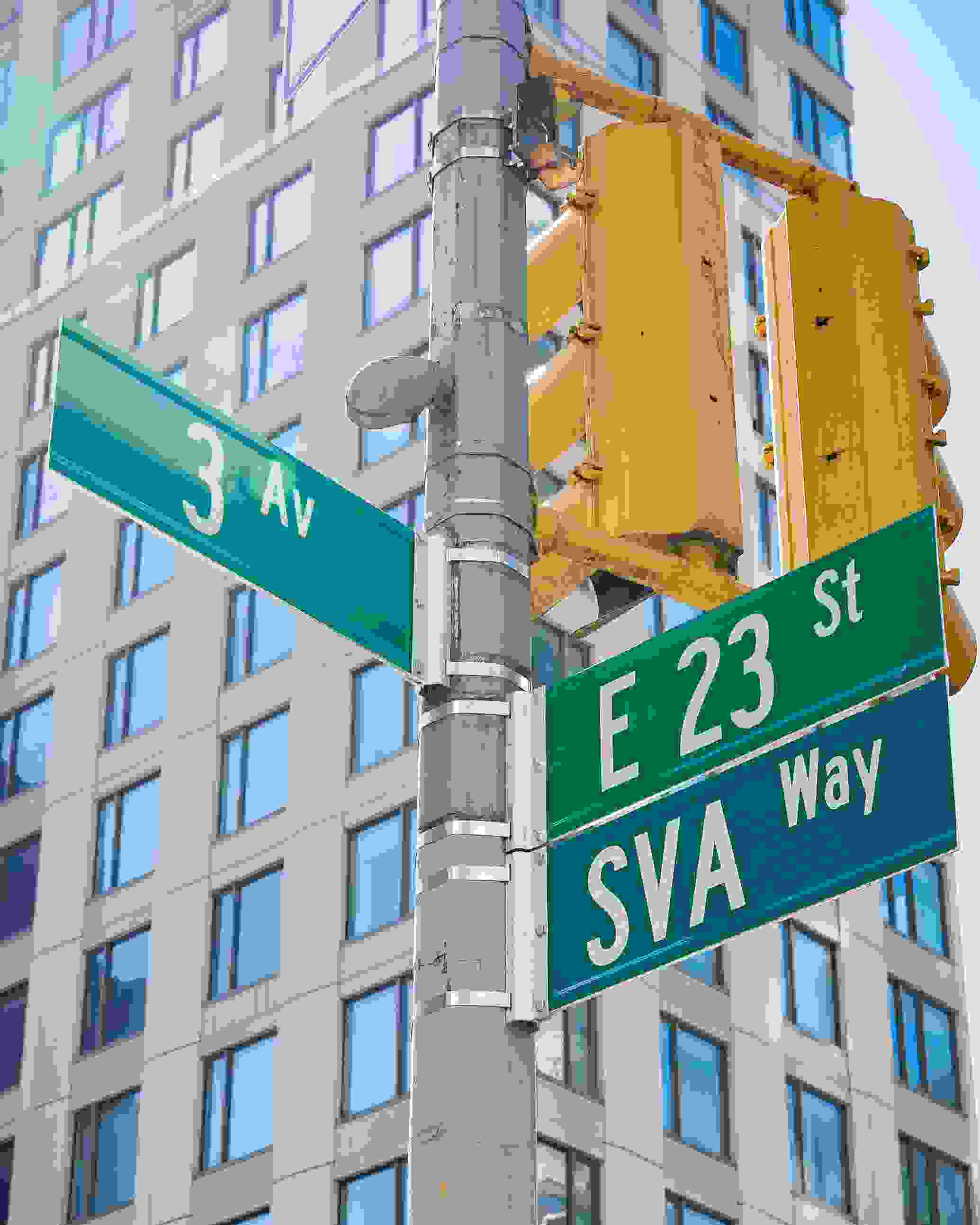 NYC cross street on the corner of 23rd St. and 3rd Ave., with newly installed “SVA Way” co-naming street sign by DOT