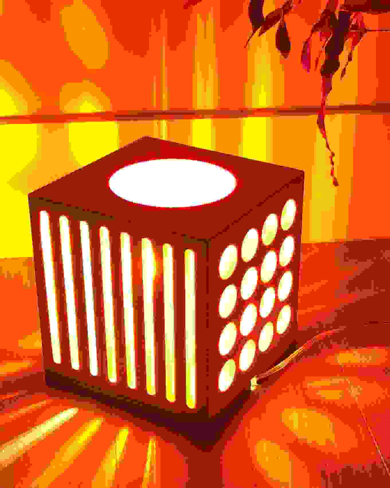 An illuminated light box on the floor of a residential space.