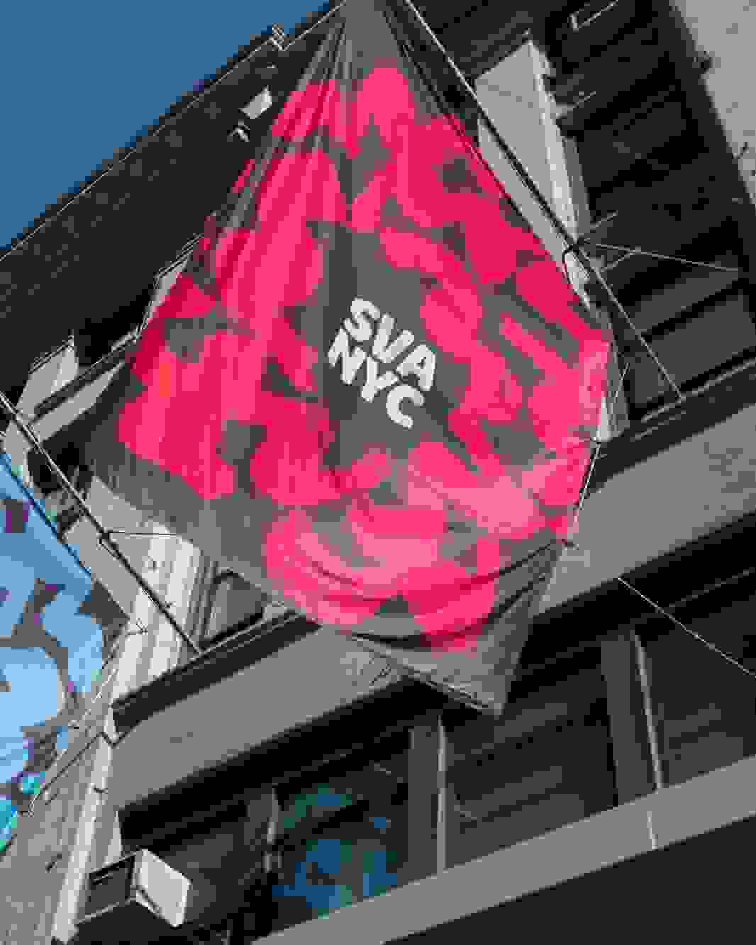 Blue and red SVA banner flags hanging outside
