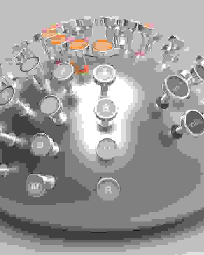 Photorealistic image of a hemispherical dome which has typewriter keys protruding from its surface like a porcupine, resting on a nondescript gray surface.