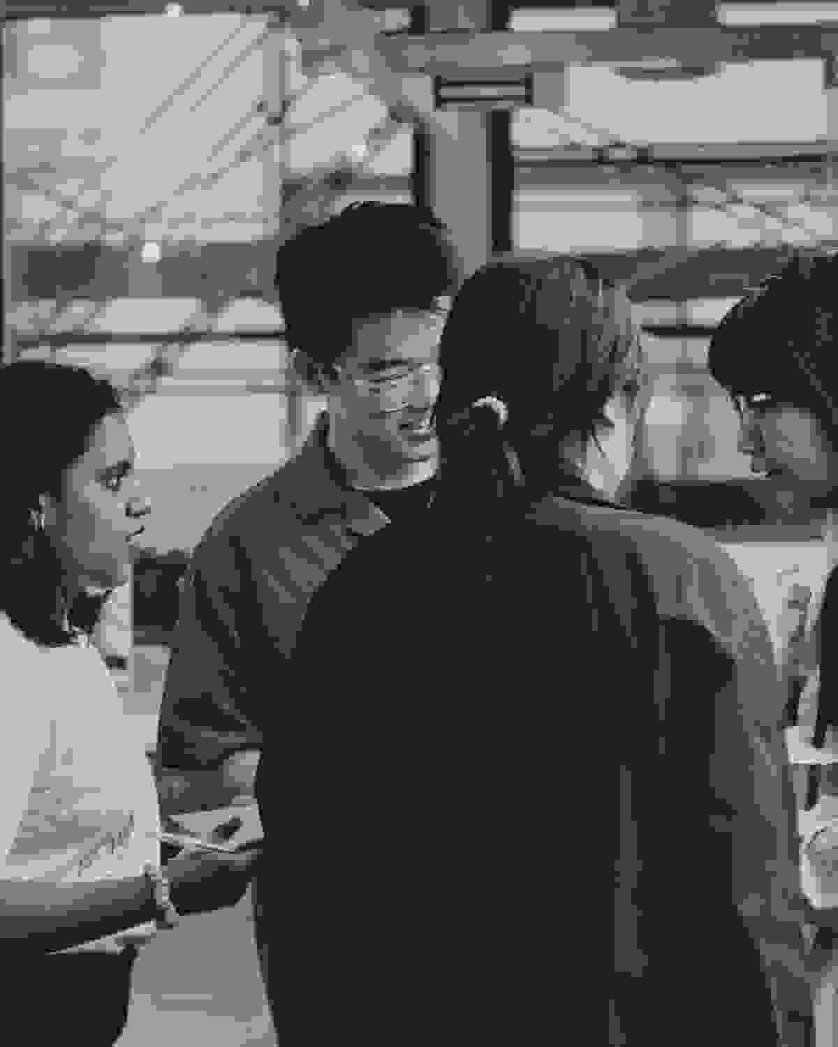 Black and white photo of students collaborating