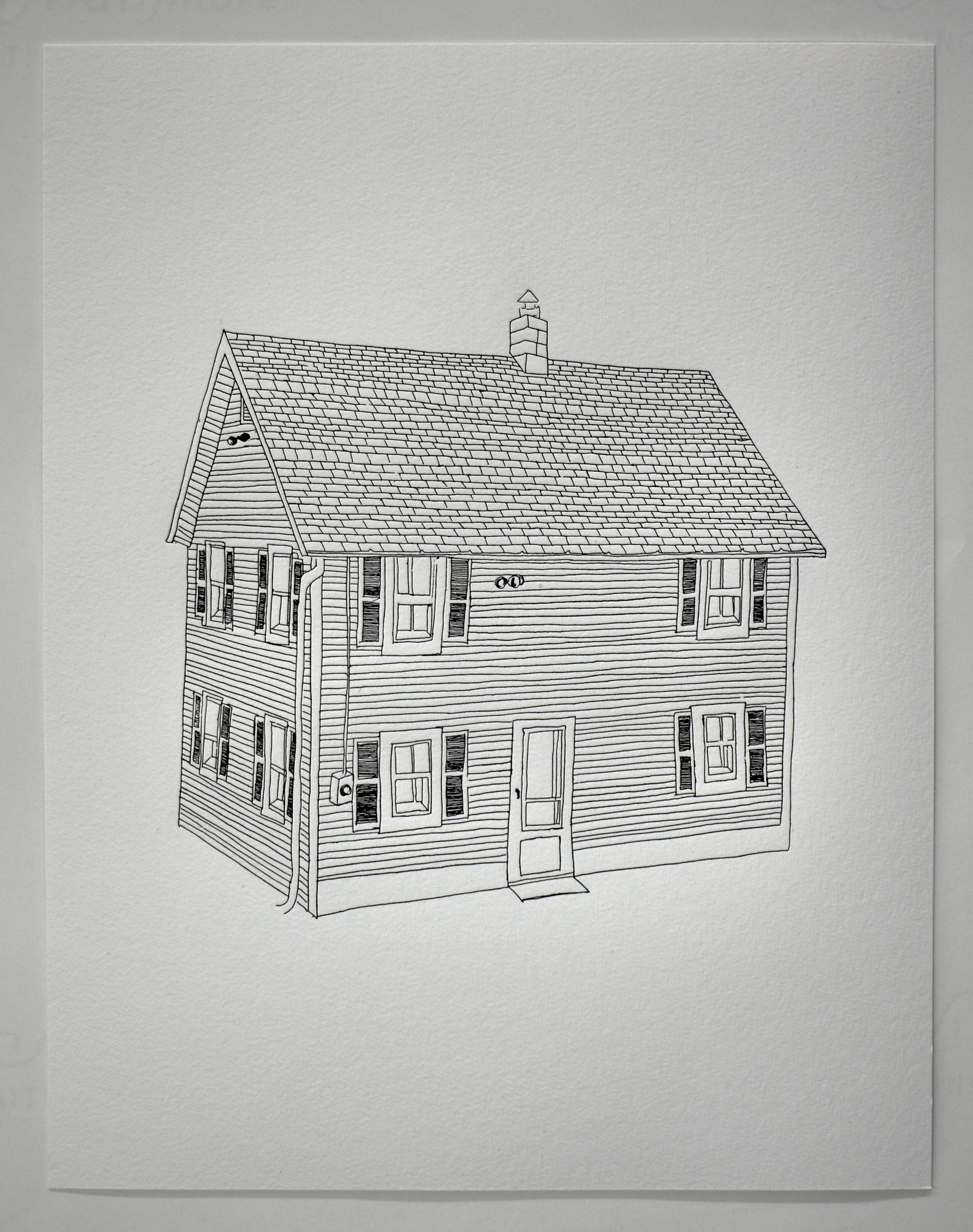 Black and white letterpress print of a house.