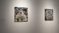 A label on the wall reads Gabrielle Benak beside two artworks. The works are chalk pastel drawings on a dark background.