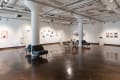 installation shot of seating and exhibitions in the front gallery