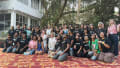 Group photo of students outside a building in India