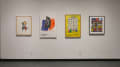 Posters from some of Chermayeff’s commercial projects hang next to each other on one wall, separate from the rest of the work. These designs have visible aesthetic connections to his collages.