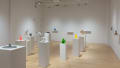 Colorful 3D printed sculptures are displayed along the walls and on standing pedestals in SVA Flatiron Gallery. 