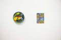 Installation shot of two small paintings.